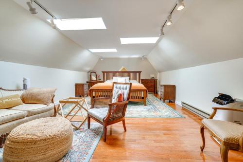 a bedroom with a bed and a couch at Studio in Historic Cathedral Hill Neighborhood! in Saint Paul