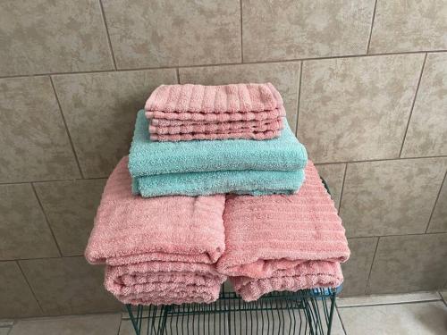 a pile of towels sitting on top of a basket at Lovely Victorian Home with Bed and Breakfast Energy in West Bergen