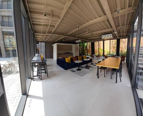 a room with a table and chairs in a building at Nuevo Penthouse con la mejor vista de Guadalajara 2501 in Guadalajara