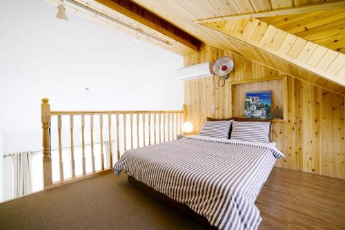 Postel nebo postele na pokoji v ubytování Walking Sky Pension