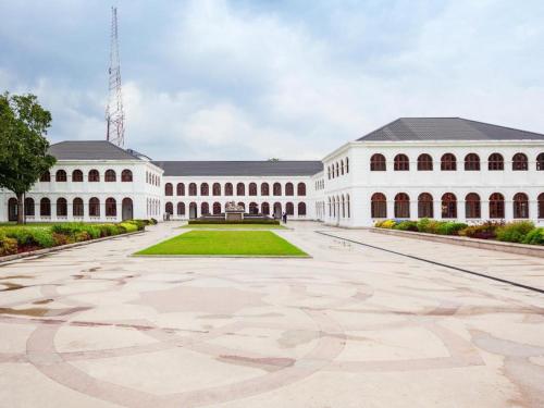 a large white building with a large courtyard at D Villas in Colombo