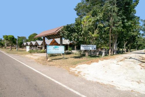 a building on the side of a road at OYO 75374 Baan Rak Mai in Kanchanaburi