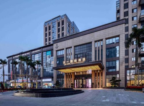 a large building in a city with a street at Taiyi International Hotel in Wenzhou