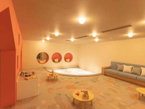 a living room with a couch and a table at Yuuyu No Sato Yusa in Yamagata