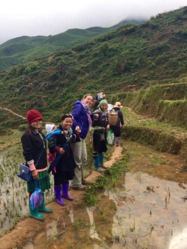 a group of people standing on a mountain trail at Tavan View Homestay in Sa Pa