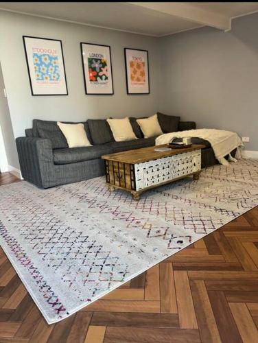 a living room with a couch and a coffee table at The Warra House in Dubbo