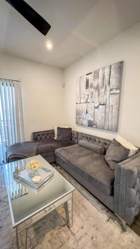 a living room with a couch and a table at Rest Away in Las Vegas