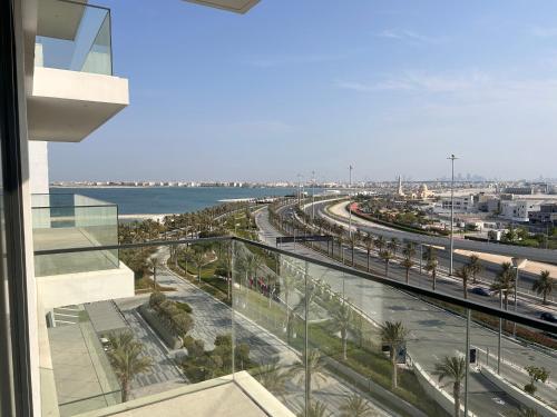 a view of a city from the balcony of a building at Address Residence Bahrain in Rayyā