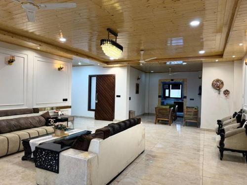 a large living room with a couch and a table at The Ivyview Villa Kumarhatti Barog Near Kasauli in Barog