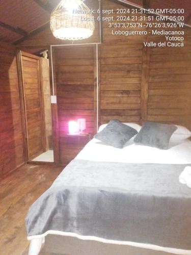 Ein Bett oder Betten in einem Zimmer der Unterkunft Ecoturismo BRISAS DÉ LA RESERVA