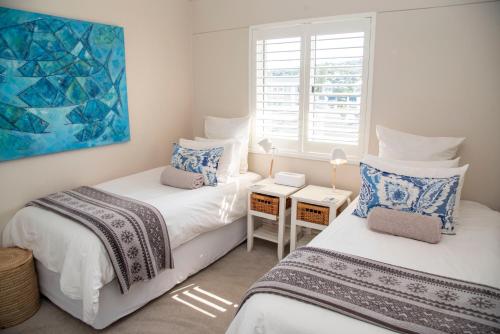 Ένα ή περισσότερα κρεβάτια σε δωμάτιο στο Waterfront - Knysna Quays Accommodation