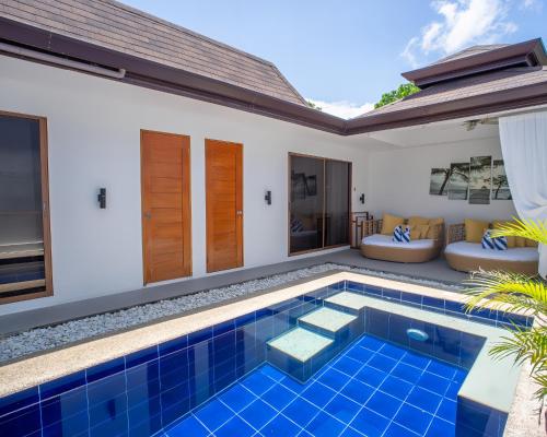 a swimming pool in the backyard of a villa at Bali Villas Panglao Bohol in Panglao