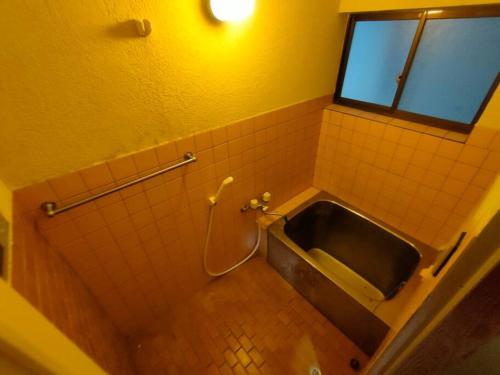 Koupelna v ubytování INN Sodeshi 丹後 一棟貸し 海の宿 INN袖志
