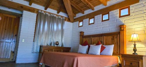 Ένα ή περισσότερα κρεβάτια σε δωμάτιο στο Infinito Cielo Hotel Boutique