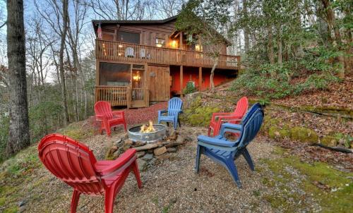 a group of chairs sitting in front of a cabin at American Dream Americana decor close to downtown Blue Ridge in Blue Ridge