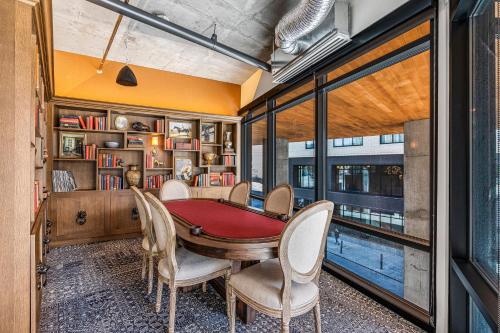 a dining room with a table and chairs and a window at Downtown views! Amazing pool gym hottub Luxury apt in Salt Lake City