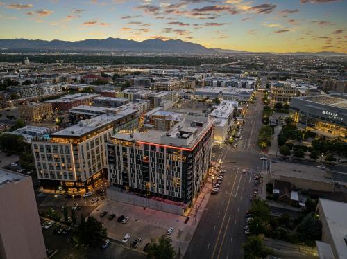 an aerial view of a city at sunset at Downtown views! Amazing pool gym hottub Luxury apt in Salt Lake City