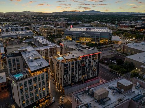 an aerial view of a city at night at Downtown views! Amazing pool gym hottub Luxury apt in Salt Lake City