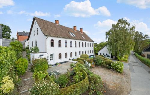 a large white house with a garden in front of it at Nice Apartment In Egernsund With Wifi in Egernsund