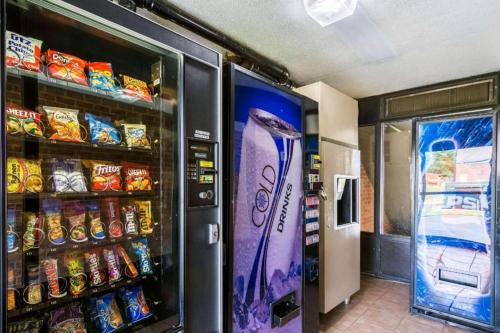 a vending machine filled with lots of chips and soda at Quality Inn in Manassas