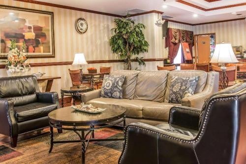 a living room with a couch and chairs and a table at Quality Inn & Suites Ann Arbor Hwy 23 in Ann Arbor