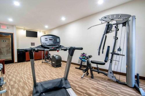 a gym with two treadmills and two exercise bikes at Comfort Inn & Suites University South in Ann Arbor