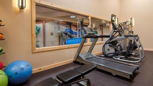 a gym with a treadmill and a mirror at Quality Inn & Suites Detroit Lakes in Detroit Lakes