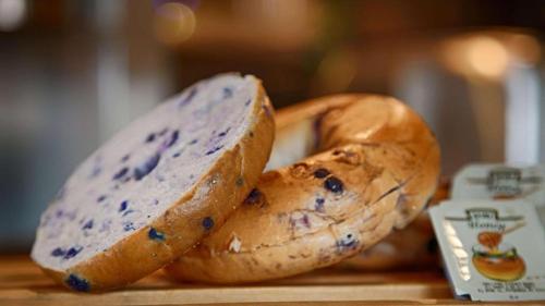 a group of bagels sitting on a cutting board at Quality Inn & Suites Detroit Lakes in Detroit Lakes