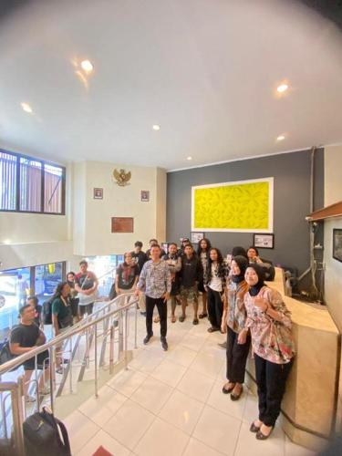 a group of people standing in a building at Alexander Hotel Tegal in Tegal