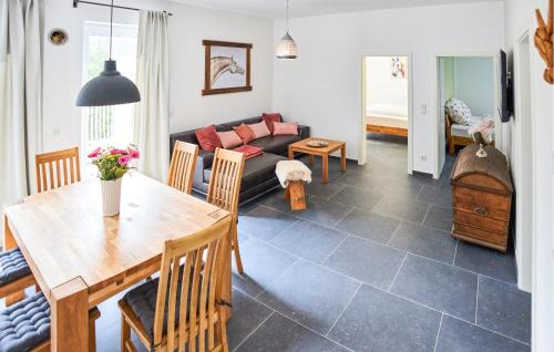 a living room with a table and a couch at Beautiful Apartment In Attendorn in Attendorn