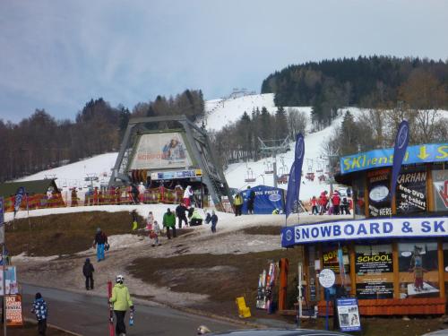 a group of people walking around a ski slope at Chalupa Krkonoše in Cerny Dul
