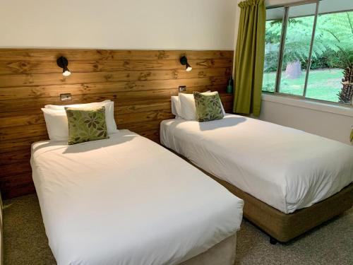 Ένα ή περισσότερα κρεβάτια σε δωμάτιο στο Warburton Motel