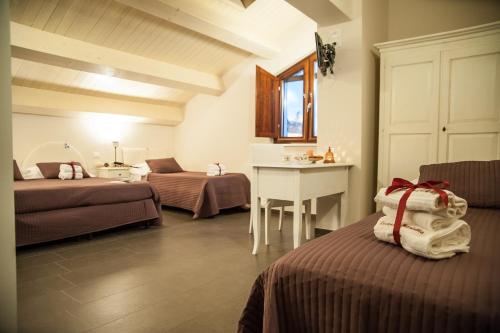Säng eller sängar i ett rum på La Locanda di Mariella dal 1950