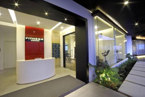 a lobby of a building with a glass door at Brits Hotel Karawang in Karawang