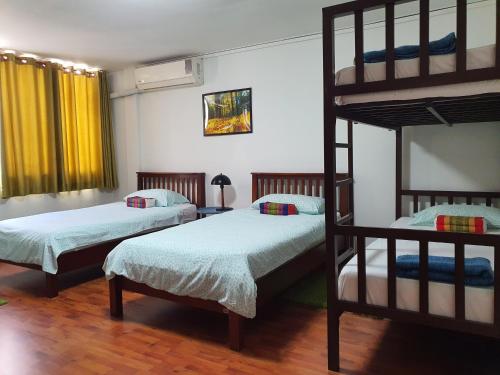 Ένα ή περισσότερα κρεβάτια σε δωμάτιο στο The Chan Vacation Home