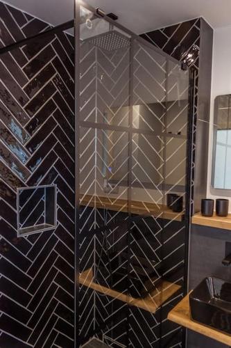 a walk in wine cellar with a glass wall at Apartment Deich 136 in Bremerhaven