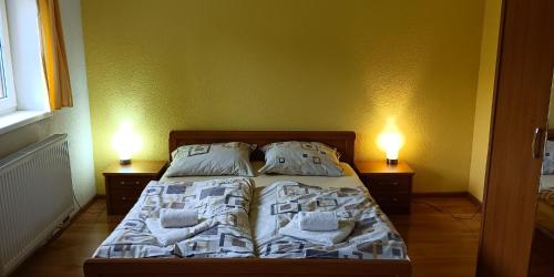 A bed or beds in a room at Chata Rossa