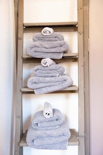a bunch of towels on a towel rack at Domaine de l'Adoux in Saint-Jean Montclar