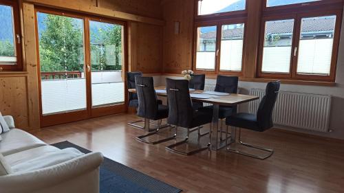 a dining room with a table and chairs at Apartment Guem in Obsteig