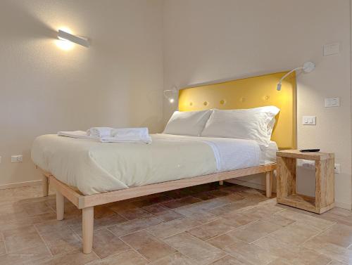 Кровать или кровати в номере Agriturismo Tenuta i 4 venti