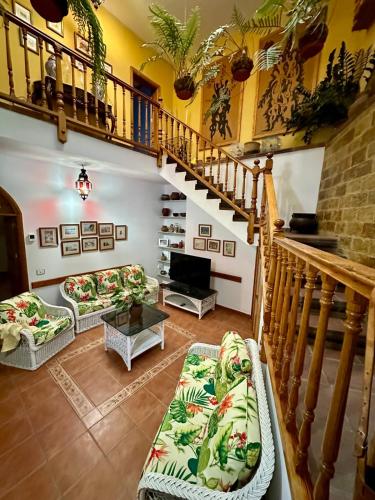 a living room with a staircase and a couch at Casa Loli y Las in Agaete