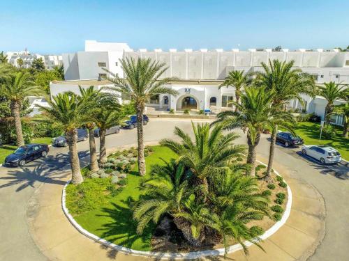 an aerial view of a building with palm trees at TUI BLUE Palm Beach Hammamet - All inclusive in Hammamet