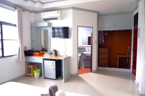 a kitchen with a sink and a counter in a room at TropiCoco Beach Resort Koh Phangan in Haad Yao