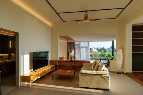 a living room with a couch and a table at Kong Garden Designer Hotel in Dali Ancient Town
