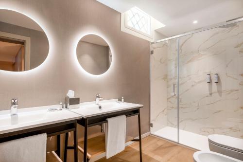a bathroom with a sink and a shower at AC Hotel by Marriott Clodio Roma in Rome