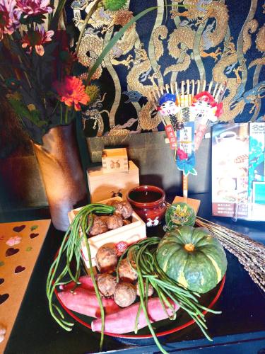 a plate of food with vegetables on a table at ペットも泊まれる小さなお宿虎凜Korin in Nagoya