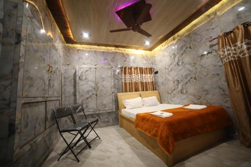 Ένα ή περισσότερα κρεβάτια σε δωμάτιο στο Maa vishalakshi home stay