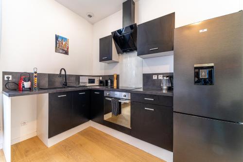 Η κουζίνα ή μικρή κουζίνα στο L'Epinal - Gare - 2 chambre - Wifi - Netflix