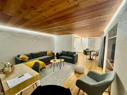 a living room with a couch and a table at Appartement Rosa au coeur des 4 Vallées in Conthey