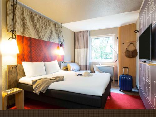 Postel nebo postele na pokoji v ubytování ibis Hotel Hamburg St. Pauli Messe